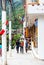 MACHU-PICCHU-PUEBLO, PERU - JUNE 7, 2019: People walk in the tourist village. Vertical