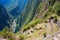 Machu Picchu terraces steep view from above to Urubamba valley below. Peru travel destination, tourism famous place.