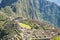 Machu Picchu terraces steep view from above to Urubamba valley below. Peru travel destination, tourism famous place.