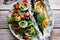 Mackerel baked in foil with vegetables on a plate.