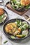 Mackerel fishcakes served with a rocket  spinach and watercress salad.