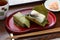Mackerel sushi wrapped by persimmon leaf; japanese food