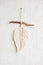Macrame leaf wall hanging in natural color on the wooden stick. Cotton rope decor macrame to make your room more cozy and unique