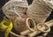 MacramÃ© still life - group of cords and threads in bowl with scissors and measure tape including wood elements to handcraft