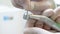 Macro 4k footage of dentist in latex gloves inserting bit in dental drill