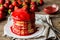 Macro american pancakes with strawberry jam on a wooden background. Shallow depth of field.