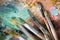 Macro artist`s palette, texture mixed oil paints in different co