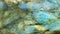 Macro background texture closeup of glowing blue labradorite gem