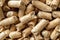 Macro background of wooden pellets. Compacted sawdust granules texture. Compressed sawdust as ecological biofuel. Alternative