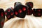 Macro of black tossed dice on wooden background