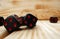 Macro of black tossed dice on wooden background