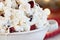 Macro of a Bowl of White Chocolate Popcorn and Cranberry Snack