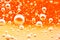 Macro bubbles of oxygen in the blood. Red-orange liquid