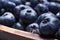 Macro Of A Bunch Of Blueberries In A Wooden Bowl