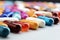 Macro close up of colorful pills spilled from a capsule on a white surface