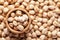 Macro Close-up of Organic chhole chana or Kabuli chana Cicer arietinum or whole white Bengal gram dal in an earthen clay pot