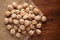 Macro Close-up of Organic Chole Chana or Kabuli Chana Cicer arietinum or whole white Bengal Gram Dal on Jute mat and wooden