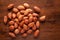 Macro Close up of organic red brown peanuts Arachis hypogaea cleaned on wooden top background