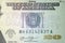 Macro. Close-up of a portion of the twenty-dollar US bill. Background for financial concept design. Serial number and