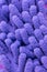 Macro close up of purple chenille microfiber texture for cleaning, trapping dust