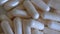 Macro Close-up of Rotating Capsules, Pharmacy Background