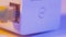 Macro close up of WiFi extender in electrical socket on the wall with ethernet cable plugged in