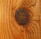 Macro close up of wood knot on freshly stained piece of lumber