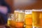 Macro closeup of a beer flight in sunlight