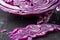 Macro closeup of detail of pieces of red cabbage, with selective focus, on black background