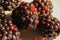 Macro closeup of isolated blackberry fruits with black ripe and red unripe seeds focus on center