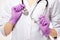 Macro cropped image of nurse palms holding stethoscope. Young medical doctor woman showing copy space for product or text.