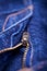 Macro Detail of a blue jeans zipper