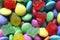 Macro detail of pile of colored smarties and candy