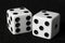 Macro dice on black felt