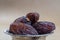 Macro of few natural dried organic sweet date fruits