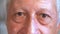 Macro footage of eyes of elderly man