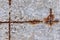 Macro fragment of an old gray concrete wall with rusty rebar