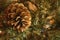 Macro of golden pinecone in artificial Christmas tree, with blurry background and copy space.