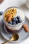 Macro granola with almond, jam, yogurt and blueberry