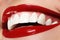 Macro happy woman\'s smile with healthy white teeth. Lips make-up.