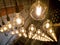 Macro image of decorative incandescent light bulbs hanging in modern interior