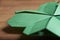 Macro image of a four-leaf clover made of green paper folded, origami