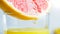 Macro image of glass of grapefruit fresh juice