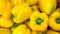 Macro image of lots of fresh yellow papricas or bell peppers. Texture or pattern of fresh ripe vegetables