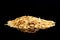 Macro image of rolled oats on a black background with copy space of the right half