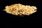 Macro image of rolled oats on a black background with copy space of the right half