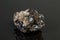 Macro mineral cassiterite stone on gray background