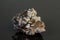 Macro mineral cassiterite stone on gray background