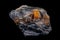 Macro of the mineral stone Columbite, Beryl, Feldspar on a black background