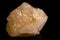 Macro mineral stone yellow calcite on white background